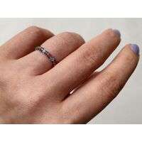 Hand wearing a bead ring